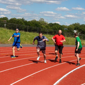 men running on a track